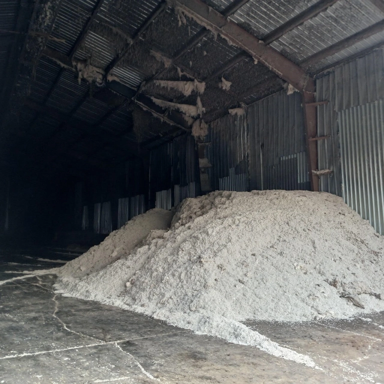 Large pile of white material in warehouse