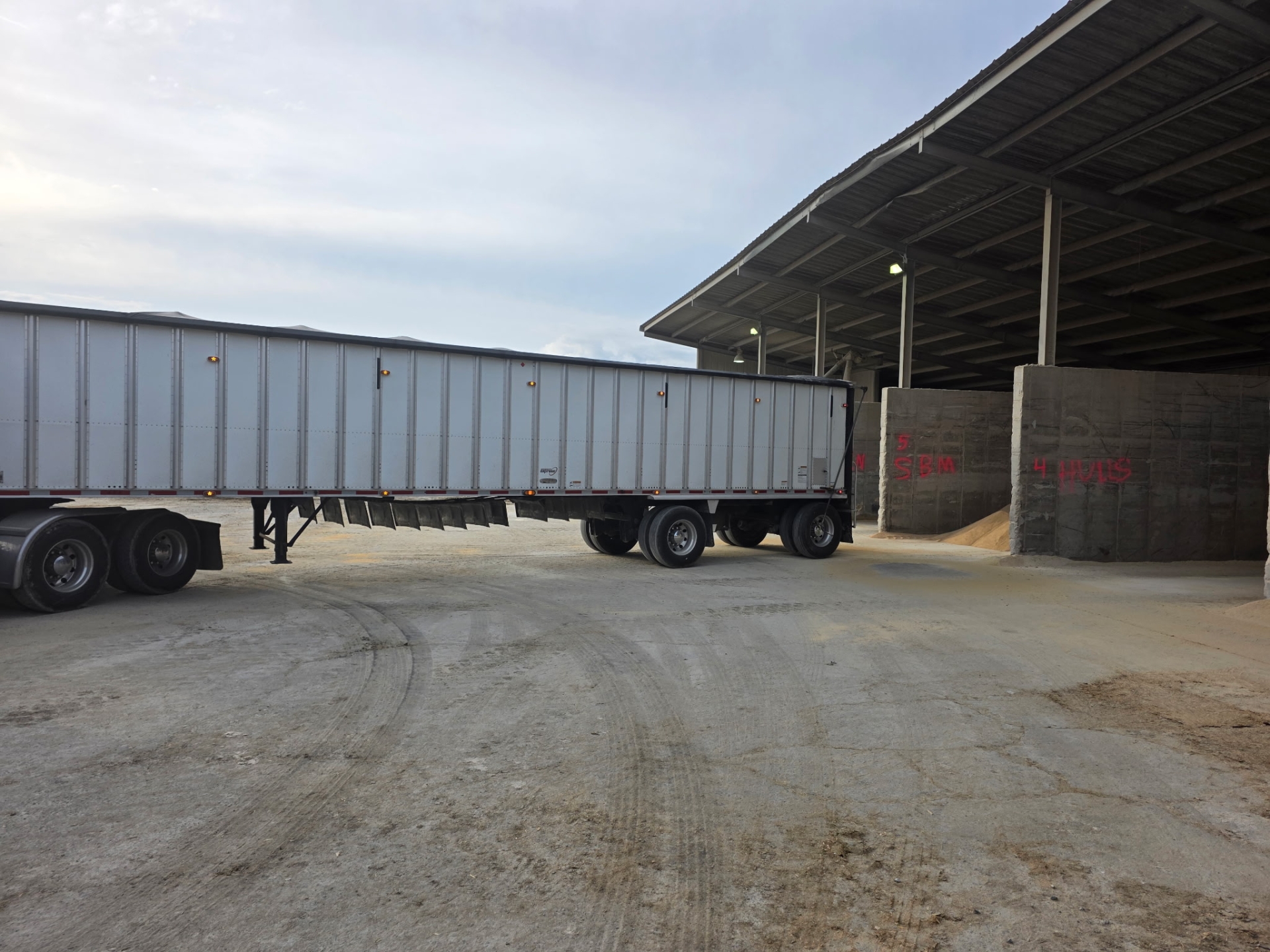 Truck trailer near warehouse storage area.