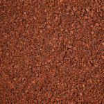 Close-up of textured brown soil surface.